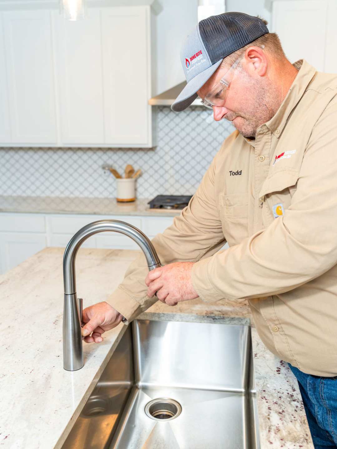 Done Rite plumber installing a kitchen faucet